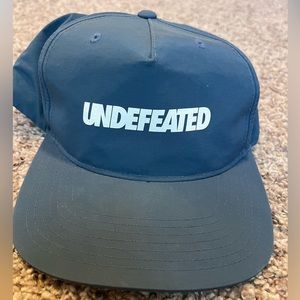 UNDEFEATED SnapBack hat, navy blue.